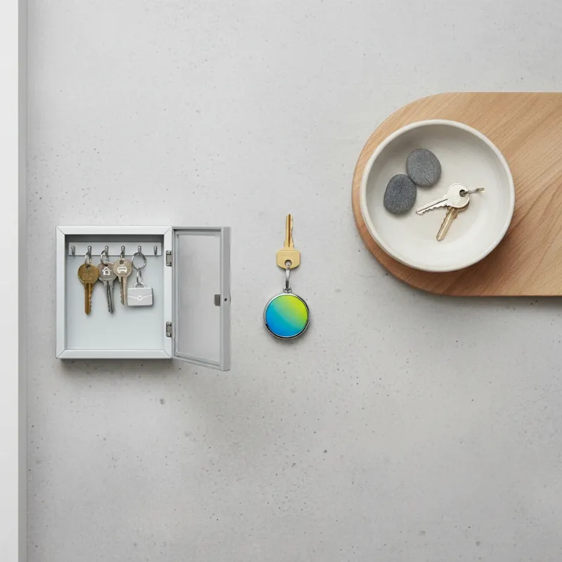 Various key management solutions including a smart key tracker, a key bowl, and a secure key cabinet